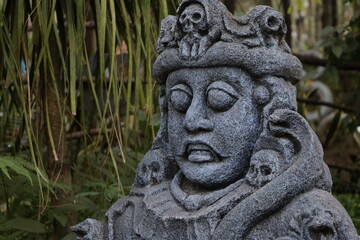 Fototapeta na wymiar stone statue in the shape of a human head