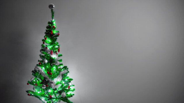 New year celebration design. A design video where you can use text, logo, visuals next to the sparkling image of the pine tree.
