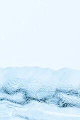 Abstract ice texture. Frozen crystals and icicles on white background. Strong frost in winter.