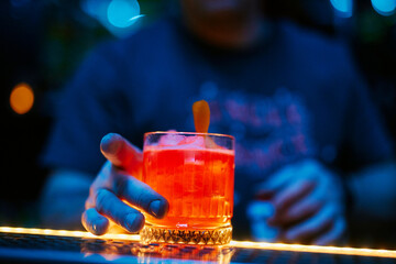 the bartender prepares a cocktail in the night bar
