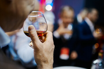 a group of men tasting real whiskey