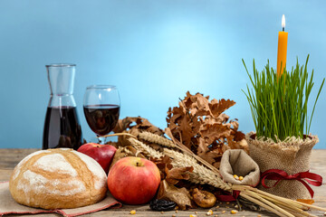 Christmas oak tree, candle, bread and dried fruits