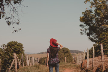 traveler girl backwards looking at a landscape view