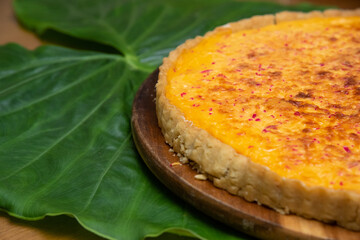 Kingdom cheese quiche on a wooden plate, kingdom cheese quiche