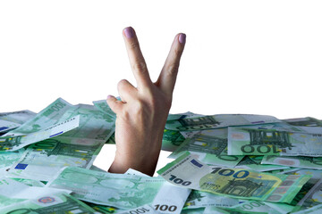 The concept of win money, a lot of money.hand shows the sign of victory from a pile of money