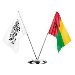 Two table flags isolated on white background 3d illustration, afghanistan and guinea-bissau