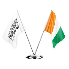 Two table flags isolated on white background 3d illustration, afghanistan and ivory coast