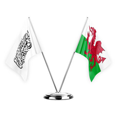 Two table flags isolated on white background 3d illustration, afghanistan and wales