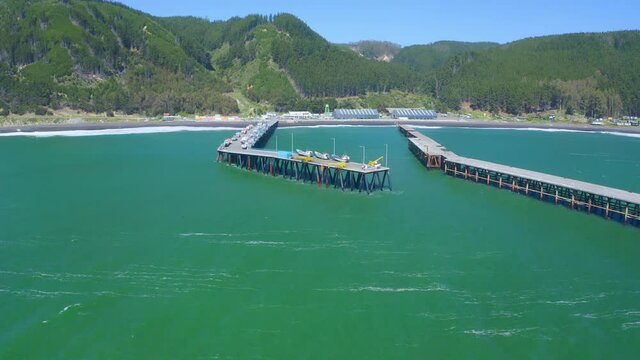 port or caleta meguellines, constitucion chile drone shot sunny day with fishing boats drone shot