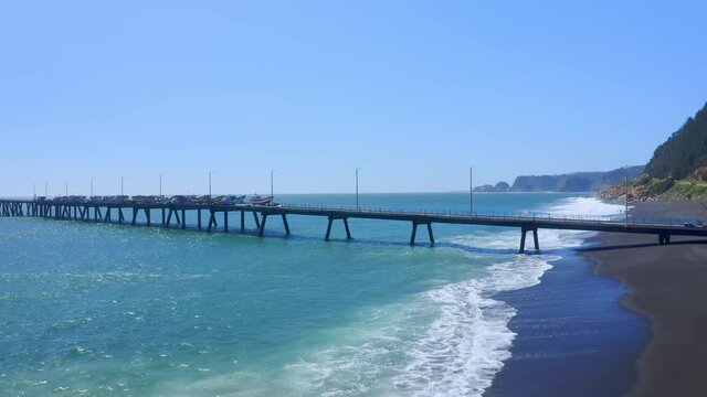 port or caleta maguellines, constitucion chile drone shot sunny day with fishing boats
surf spot traveling left