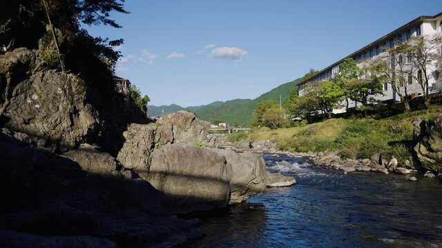 Yoshida River flowing through Gujo-Hachiman on warm Japanese Summer Day