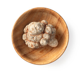 Dried notoginseng in the wooden bowl,  isolated on white background, top view