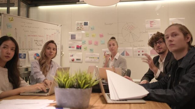 Meeting of a professional team, multiracial colleagues and coworkers brainstormed and presentation in conference room of business office with Caucasian female boss, discussing finance and marketing.