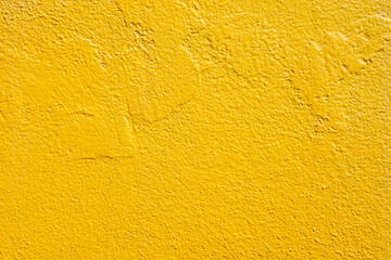 surface of blank rough yellow concrete wall for background.