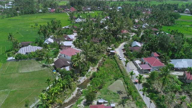 Areal view Kawasan Saribu Rumah Gadang in Solok Selatan, KPGD West Sumatra, Indonesia during the day under blue skies. Cinematic 4K Drone aerial shot