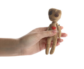 Woman holding voodoo doll with pin in heart on white background, closeup
