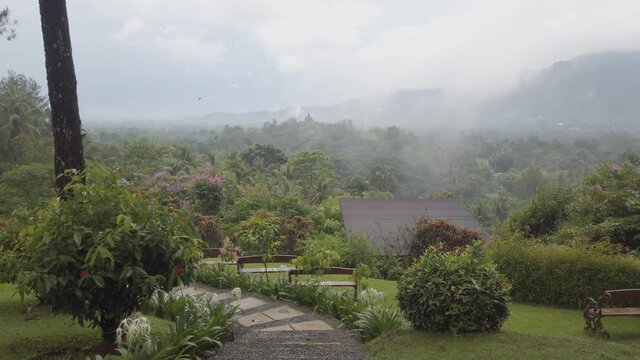 Misty Borobudur temple seen from Dagi hill, Magelang, Central Java, Indonesia.