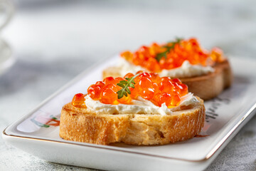 Bruschetta with cheese and red caviar