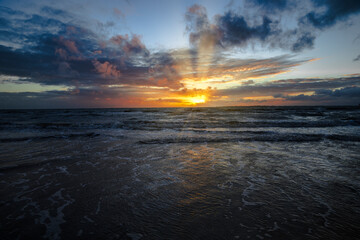 Beautiful beach sunset or sunrise over the water at dusk in southwest Florida at Fort Myers beach
