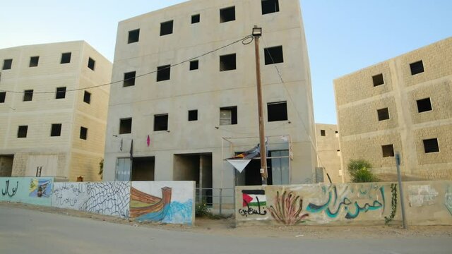 military training city buildings with palestine grafitty and drawings on the walls