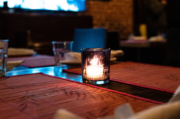 lone candle in Toronto restaurant 