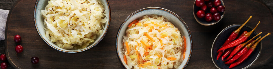 Sauerkraut on wooden background.