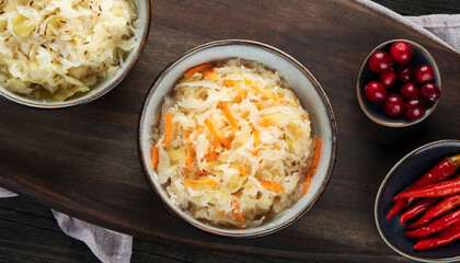 Sauerkraut on wooden background.