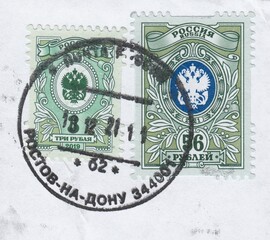 State postal administration emblem double-headed eagle with post horns. Postmark Rostov-on-don, stamp Russia 2021