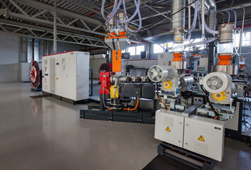 Atyrau,Kazakhstan - May 21,2012: Chevron plant interior. Plastic pipes modern production line. No people.