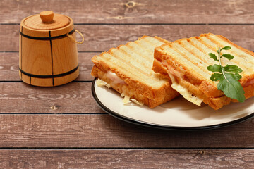 Homemade grilled cheese sandwiches for breakfast on wooden boards.