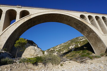 underneath view old stone bridge in the calanques near marseille france