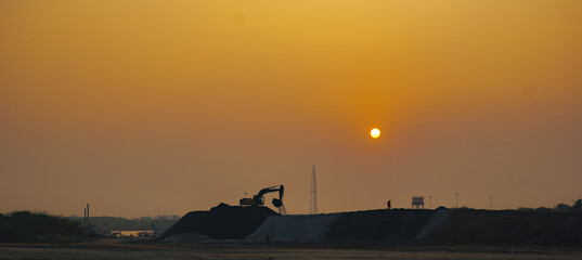 sunset over the working site
