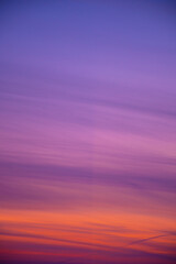 Vivid evening sky colors in winter. Orange, purple and blue sunset. Bright twilight in winter. Romantic view. Selective focus on the details, blurred background.