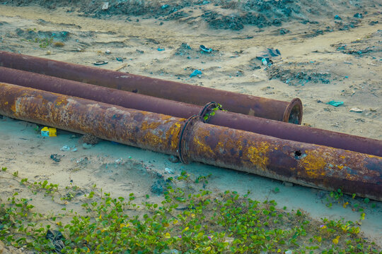 rusty pipes on the beach