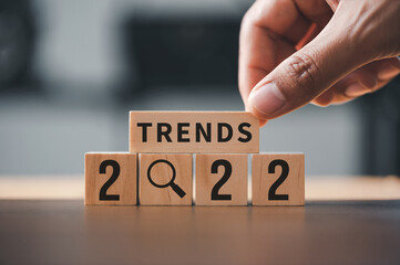 2022 trends concept with text on the wooden cube for trend concept in the new year for business...