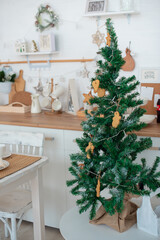 christmas tree decorated for Christmas in the kitchen