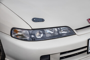 Obraz na płótnie Canvas 古い自動車のヘッドライト　Headlight of the old car