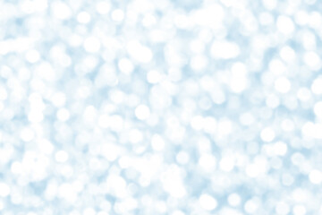 Abstract white and blue snowfall bokeh background. New Year, Christmas and all celebration concept.  Snow in the winter.  Romance and wedding anniversary background.
