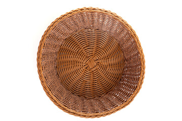 Fototapeta premium empty round wicker basket for fruit or sweets on a white background, top view