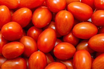 Red plum cherry tomatoes. Close up selective focus.
