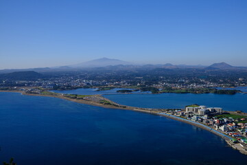 Blue sea and sky scenery of Seongsan Ilchulbong (UNESCO World Heritage Site) in Jeju Island, South Korea