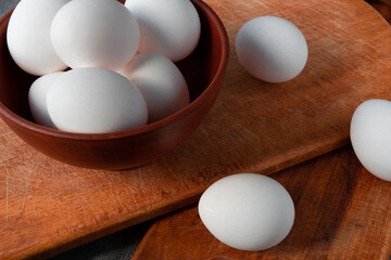 raw beautiful chicken eggs in a clay plate