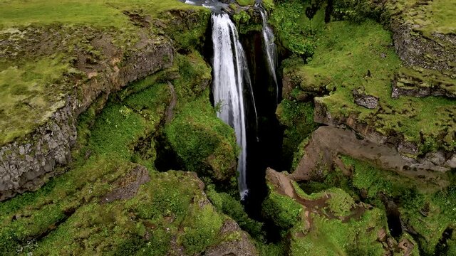 Cinematic aerial footage of the Beautiful Seljalandsfoss and Gljufrabui waterfalls in Iceland on summer