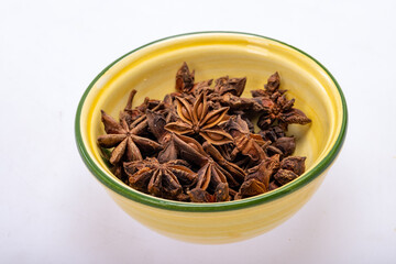 Star anise in a vintage ceramic bowl