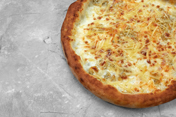 Closeup view of four cheese pizza isolated over white.