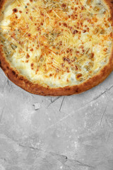 Closeup view of four cheese pizza isolated over white.