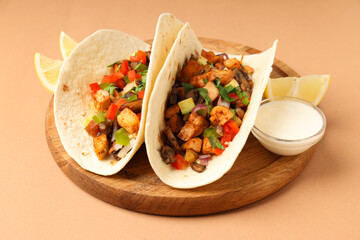 Concept of tasty food with taco on beige background
