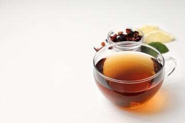 Concept of hot drink with tea on white background