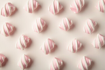 White and pink marshmallow on white background. Pastel creative textured pattern. minimal
