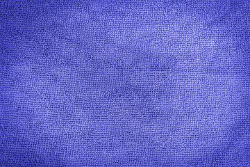 Close-up of abstract fabric texture as background for text or interior design. Blue artificial fabric texture.  